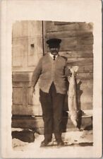 Vintage 1910s Real Photo RPPC Postcard Man with Really Big Fish / Winter Scene picture