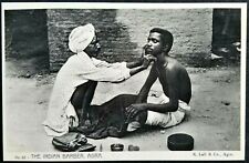 Street Barber Shaves Man Sitting on the Ground, Agra, India. Black & White. picture