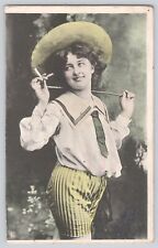 Postcard Lady In Striped Shorts & Hat Smoking A Cigarette Antique Hand Colored picture