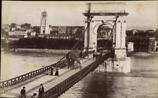 Valencia, carriages and walkers on the suspension bridge, facing the Holy Cathedral picture