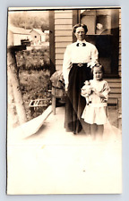 RPPC Stoic Mother & Daughter Holding Doll on House Porch Real Photo Postcard picture