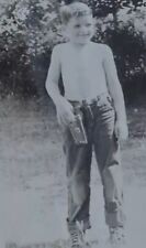 Vintage B&W Photograph Of 8yr Old Boy Standing Outside Holding Gun Holster picture