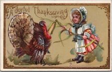 1910 THANKSGIVING Postcard Girl Trying to Feed Entire Corn Stalk to Turkey picture