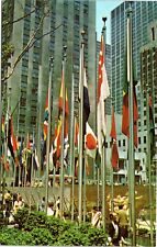Rockefeller Plaza sunken plaza, view of UN Flags, NYC postcard picture