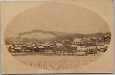 RPPC Picturesque snow-covered town in hills picture
