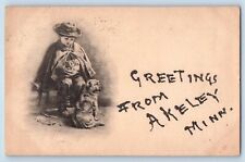 Akeley Minnesota Postcard Greetings Glitter Boy Child Dog c1907 Vintage Antique picture