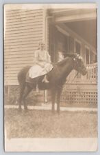 RPPC of Young Girl Sitting on Brown Horse Postmarked 1911 Rochester NY Postcard picture