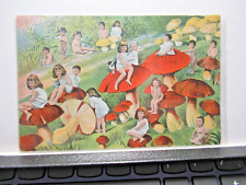 UNUSUAL HUMOROUS POSTCARD SHOWING MANY CHILDREN SITTING AMONGST MUSHROOMS picture