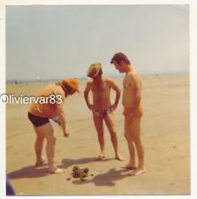 Vintage photo 1975 - 2 man in speedo swimsuit and another standing on the beach picture