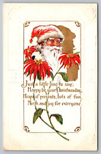 Santa Claus and Pointsettia Embossed Antique Christmas Postcard with Poem c1914 picture
