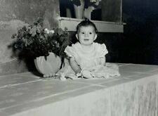 Baby Sitting On Table By Flowers B&W Photograph 3.75 x 4.75 picture