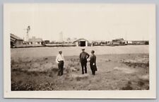 RPPC People Standing in Field, Windmill and Farm c1920  Real Photo Postcard picture