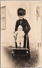 Vintage 1910s Real Photo RPPC Postcard Older Woman Holding Baby Upright on Chair picture