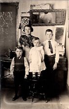 Real Photo Postcard Four Children Inside of a Home picture