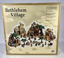 Porcelain Bethlehem Village W/ 22 Resin Figurines 2 Versions Of The Holy Family  picture