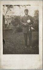 RPPC Antique Postcard Shy Handsome Young Man Holding Flowers in Garden Suitor? picture