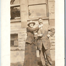 c1910s Fun Lady Makes Man Smile RPPC Outdoors Stone Building Woman Photo PC A214 picture