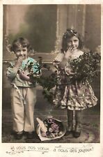 VINTAGE POSTCARD TWO SMILING YOUNG GIRLS BOUQUETS OF FLOWERS c. 1916-1920 picture