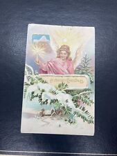 c1910's Christmas Angel Candle Light Pine Cone Winter Embossed Tuck's Postcard picture