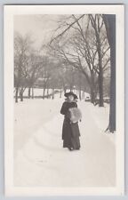 RPPC Young Edwardian Woman Standing In Snow With Hat and Fur Muff Handwarmer picture