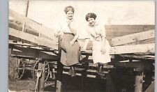 LADIES RIDING BACK OF WAGON c1910 real photo postcard rppc fun farm girls picture