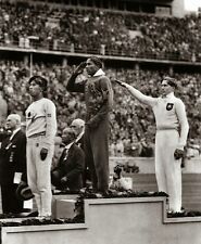 Jesse Owens salutes during 1936 Summer Olympics in Berlin 8