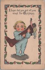 Postcard Christmas Child Holding Stocking with Toys  picture