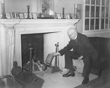 English architect Sir Edwin Lutyens stokes fire at his home  OLD PHOTO picture