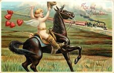 Embossed Valentine Postcard 475 Cowboy Cupid on Horse Waves to Train picture