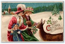c1910's Christmas Woman And Girl Feeding Deer Berries Winter Embossed Postcard picture