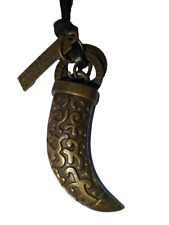 Leather collar, old brass dagger picture