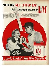 1956 L&M Cigarettes man woman dressed for cold winter Vintage Print Ad picture