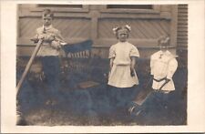 Real Photo Postcard Three Children Outside Wooden Wheelbarrow Push Mower picture