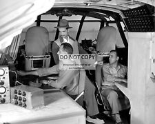 HOWARD HUGHES IN THE COCKPIT OF THE 