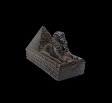 The ancient Egyptian Pharaonic Sphinx and the rare and unique pyramid statue picture