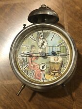 Antique Metal Animated Motion Drum Alarm Clock: Mother Rocking Baby picture