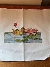 Beautiful Cross Stitched Swimming Duckling in Pond Near Pink Water Lily Flower picture