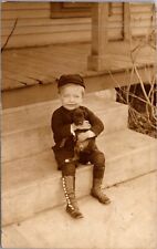 Real Photo Postcard Little Boy Holding Puppy on a Porch Clarence Lindsay Kansas picture