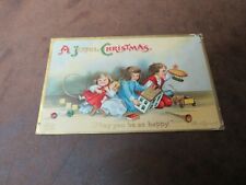 Old Vintage Merry Christmas postcard Children with presents 1909 Joyful boy girl picture