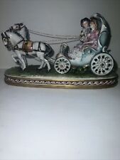Vintage Capodimonte couple in open carriage  picture