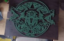 Stainless Steel Enameled Green Wolf Pack On Wood picture