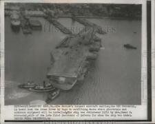 1954 Press Photo Forrestal Ship towed by tugs for the installation of equipment picture