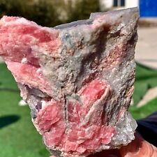 208G  Mineral specimens of natural rhodochrosite coexisting with purple fluorite picture