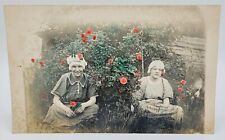 HAND COLORED RPPC~TWO YOUNG WOMEN BONNETS~FLOWERS & LEAVES TINTED~CIRCA 1910 picture