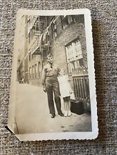 WWII Photo Big City GI Awkwardly￼ Poses With Girl By Brick Apartment Soldier picture