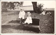 c1920s Real Photo RPPC Postcard Boy & Girl on Blanket in Yard / Dog Nearby picture
