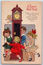 New Year Postcard Childrens Playing Clock Angel c1910's Unposted Antique picture