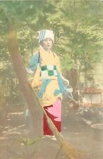 Postcard C-1910 Japan hand colored ethnic dress woman watering garden 24-5480 picture