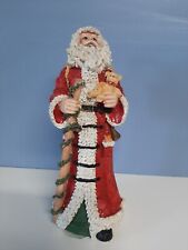 Santa Clause Figurine. Apx. 9.5 Inches. Holding Teddy Bear. Resin picture