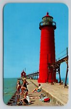 Visit The Grand Haven Michigan Area Vintage Unposted Postcard Fishing Lighthouse picture